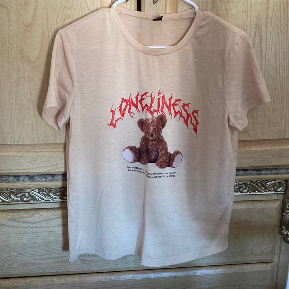 this t-shirt is from SHEIN it is a M and very cute but my boobs don’t fit in it